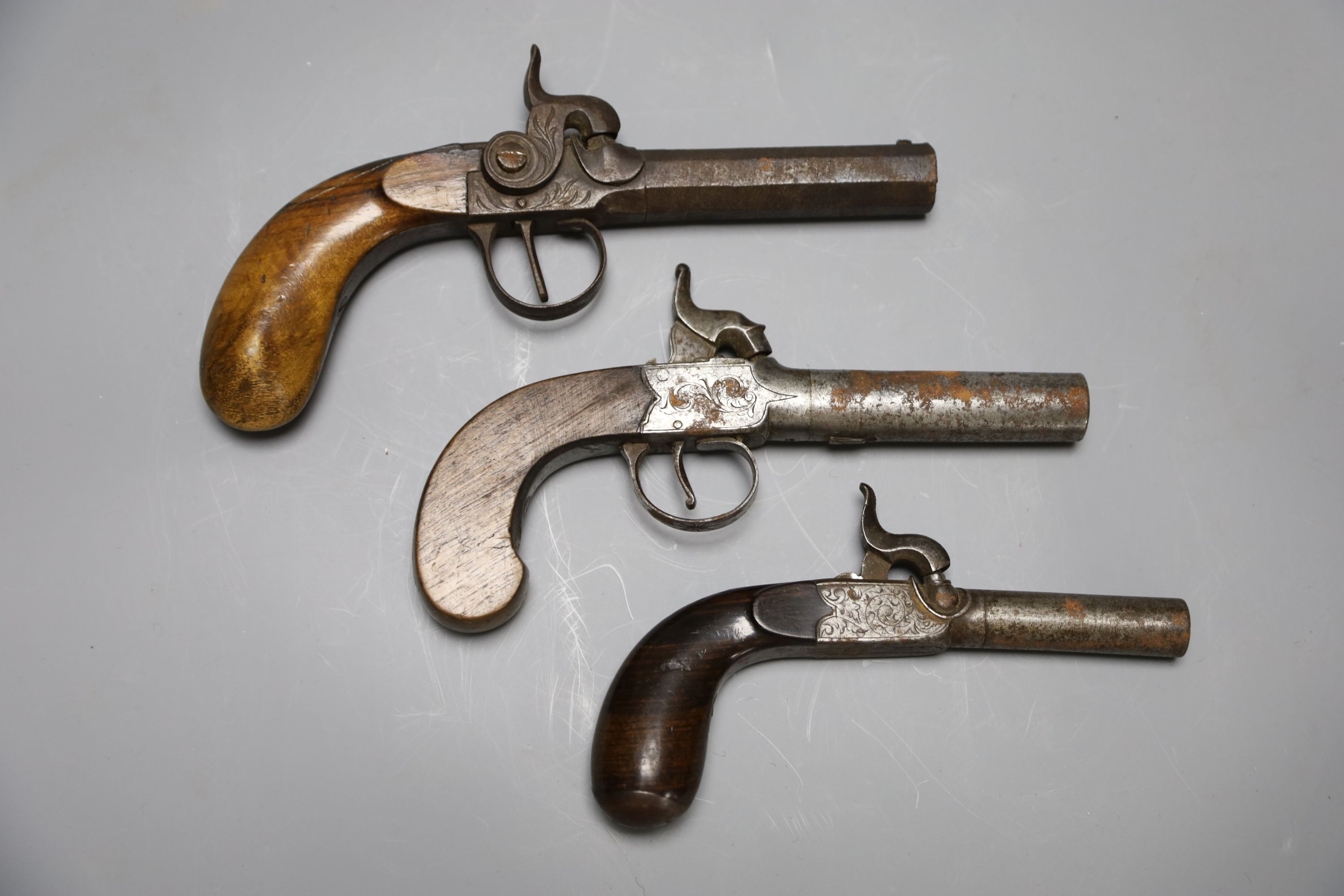 A Wilson of London box lock percussion cap pistol and two others